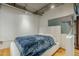 Modern bedroom with platform bed, stylish industrial ceiling and unique glass pane accent at 21 E 6Th St # 311, Tempe, AZ 85281