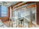 Modern dining area with metallic wall treatment, ductwork, and city views at 21 E 6Th St # 311, Tempe, AZ 85281