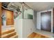 Hallway shows the transition from wood to tile floor, as well as stairwell and storage at 21 E 6Th St # 311, Tempe, AZ 85281