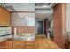 Kitchen features stainless steel counter and backsplash, light wood cabinets and exposed ductwork at 21 E 6Th St # 311, Tempe, AZ 85281
