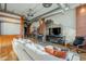 Bright living room featuring hardwood floors, exposed brick walls, ductwork, and an open floor plan at 21 E 6Th St # 311, Tempe, AZ 85281