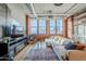 Spacious living room with exposed ductwork, large windows, and a comfortable sectional sofa at 21 E 6Th St # 311, Tempe, AZ 85281