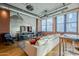 Open concept living area with modern decor, hardwood floors, and exposed ductwork at 21 E 6Th St # 311, Tempe, AZ 85281