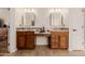 Bathroom featuring dual sinks, granite countertops, and rich wood cabinetry at 22318 N Pico Ct, Sun City West, AZ 85375