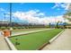 Bocce ball court with a manicured lawn and seating, perfect for friendly outdoor competition at 22318 N Pico Ct, Sun City West, AZ 85375
