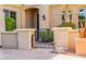Charming gated entrance with lush landscaping, creating a welcoming and secure approach to the property at 22318 N Pico Ct, Sun City West, AZ 85375