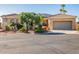Charming exterior with a desert landscaped front yard and a two-car garage, creating excellent curb appeal at 22318 N Pico Ct, Sun City West, AZ 85375