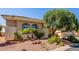Well-maintained home featuring manicured landscaping, desert rock and native plants surrounding a welcoming exterior at 22318 N Pico Ct, Sun City West, AZ 85375