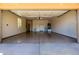 Clean and spacious garage with epoxy flooring, ample storage, and easy access at 22318 N Pico Ct, Sun City West, AZ 85375