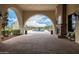 Lobby entryway offering an archway view of the fountain, landscaping, and golf course at 22318 N Pico Ct, Sun City West, AZ 85375