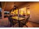 Covered patio with comfortable seating area offering a relaxing outdoor experience at 22318 N Pico Ct, Sun City West, AZ 85375