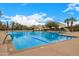 Outdoor pool with lap lanes, lounge chairs, and shade awnings for a relaxing experience at 22318 N Pico Ct, Sun City West, AZ 85375