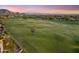 Aerial view overlooking the golf course, showcasing the manicured green and the lush surroundings at 25150 N Windy Walk Dr # 37, Scottsdale, AZ 85255
