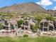 Beautiful aerial view of upscale homes in a golf course community, showcasing mountain views and landscaping at 25150 N Windy Walk Dr # 37, Scottsdale, AZ 85255