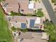 Overhead view of luxury home with solar panels, manicured landscaping, and outdoor living spaces at 25150 N Windy Walk Dr # 37, Scottsdale, AZ 85255