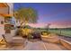 Desert landscaping and an over the top back patio provide a stunning backdrop for outdoor living at 25150 N Windy Walk Dr # 37, Scottsdale, AZ 85255