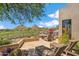 Outdoor patio with lounge chairs and seating, and view of the golf course and mountains at 25150 N Windy Walk Dr # 37, Scottsdale, AZ 85255