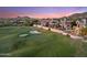 Stunning backyard view with a golf course, lush greenery, and mountain views at 25150 N Windy Walk Dr # 37, Scottsdale, AZ 85255