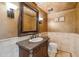 Charming bathroom features an ornate mirror, wall sconces, and decorative wall and floor details at 25150 N Windy Walk Dr # 37, Scottsdale, AZ 85255