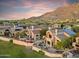 Beautiful stucco home with a landscaped patio, BBQ, and mountain views at 25150 N Windy Walk Dr # 37, Scottsdale, AZ 85255