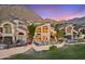 Elegant stucco home with private outdoor patio, built-in BBQ, desert landscape, and sunset views at 25150 N Windy Walk Dr # 37, Scottsdale, AZ 85255