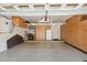 Spacious garage with ample storage cabinets, epoxy flooring, and overhead storage racks at 25150 N Windy Walk Dr # 37, Scottsdale, AZ 85255