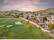 Scenic golf course living with lush greens, desert landscape, and a luxurious stucco home at 25150 N Windy Walk Dr # 37, Scottsdale, AZ 85255