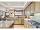 Kitchen with granite countertops, stainless steel appliances, and large window with desert views at 25150 N Windy Walk Dr # 37, Scottsdale, AZ 85255