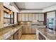Gourmet kitchen with stainless steel appliances, granite countertops, and custom cabinetry at 25150 N Windy Walk Dr # 37, Scottsdale, AZ 85255