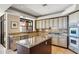 Well-appointed kitchen boasts granite countertops, stainless steel appliances, and an island at 25150 N Windy Walk Dr # 37, Scottsdale, AZ 85255