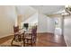 Upstairs loft area with wood floors, vaulted ceilings, decorative rug, and wrought iron railing at 25150 N Windy Walk Dr # 37, Scottsdale, AZ 85255