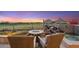 Backyard view showcases a fire pit, waterfall, and in-ground spa with golf course views at 25150 N Windy Walk Dr # 37, Scottsdale, AZ 85255
