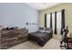 This cozy bedroom is bathed in warm, inviting light, creating a serene retreat at 28623 N 66Th Ave, Phoenix, AZ 85083