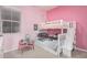 This pink bedroom features a bunk bed with playful decor and ample natural light at 28623 N 66Th Ave, Phoenix, AZ 85083
