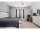 Calm bedroom with carpet flooring, ceiling fan, and a bright sunny window at 28623 N 66Th Ave, Phoenix, AZ 85083