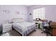 Cozy bedroom with light purple walls, carpet and a bright window at 28623 N 66Th Ave, Phoenix, AZ 85083