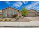 Well-maintained single-story home featuring desert landscaping, a paver driveway, and a two-car garage at 28623 N 66Th Ave, Phoenix, AZ 85083