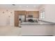 Spacious kitchen featuring granite counters, stainless steel appliances, and tile flooring at 28623 N 66Th Ave, Phoenix, AZ 85083