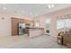 The kitchen features stainless steel appliances, ample counter space, and warm, inviting lighting at 28623 N 66Th Ave, Phoenix, AZ 85083