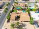 Aerial view of a home showcasing pool, patio area, desert landscaping, and a terracotta tiled roof at 302 E Acapulco Ln, Phoenix, AZ 85022