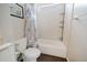 Bright bathroom features a tub with tile surround, built-in shelves, and modern fixtures at 302 E Acapulco Ln, Phoenix, AZ 85022