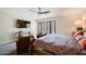 Bedroom with outdoor access and television at 302 E Acapulco Ln, Phoenix, AZ 85022