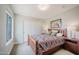 Comfortable bedroom features a window, a closet, and carpet floors at 302 E Acapulco Ln, Phoenix, AZ 85022