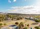 Picturesque community offering mature trees and landscaping with outdoor amenities, set against a mountain backdrop at 302 E Acapulco Ln, Phoenix, AZ 85022
