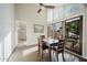 Dining area features a table and chairs with large windows and sliding door at 302 E Acapulco Ln, Phoenix, AZ 85022