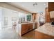 Open kitchen features granite countertops, stainless steel appliances and large windows at 302 E Acapulco Ln, Phoenix, AZ 85022