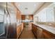 Bright kitchen with stainless steel appliances, granite countertops, and lots of storage at 302 E Acapulco Ln, Phoenix, AZ 85022