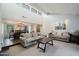 Open floor plan with a large living room and dining area, high ceilings, and plenty of natural light at 302 E Acapulco Ln, Phoenix, AZ 85022