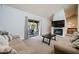 Inviting living space with a fireplace, a sliding glass door and comfortable seating at 302 E Acapulco Ln, Phoenix, AZ 85022