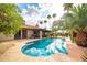 Sparkling pool with lush landscaping and an outdoor seating area at 302 E Acapulco Ln, Phoenix, AZ 85022